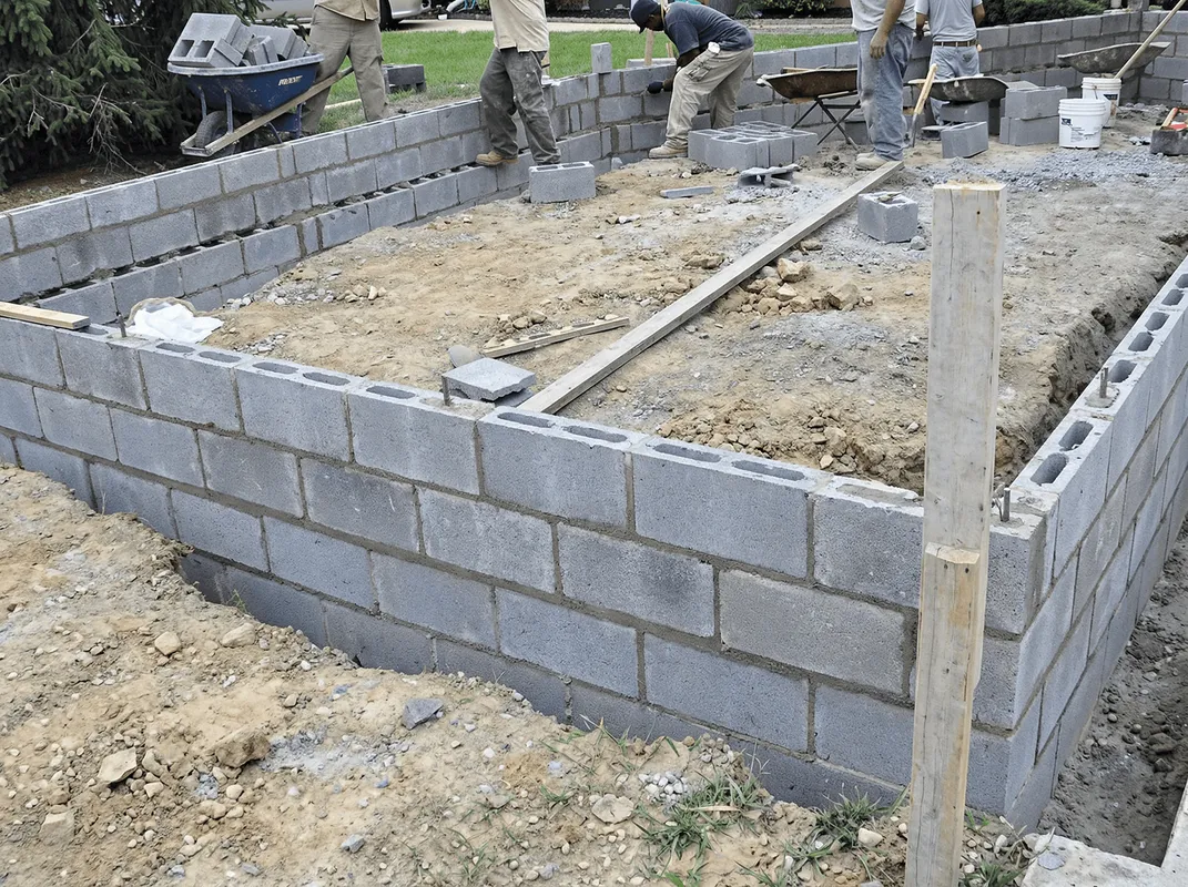 Professionals building a foundation with blocks in Kansas City, MO
