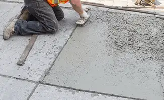 Professional repairing a concrete floor in Kansas City, MO