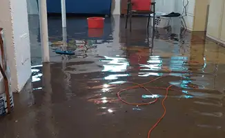Basement with boiler, cabinets and washing machine completely flooded in Kansas City, MO